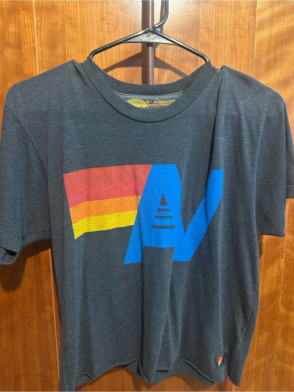 Aviator Nation Charcoal Tee with Blue AV and Red-Orange-Yellow Stripe